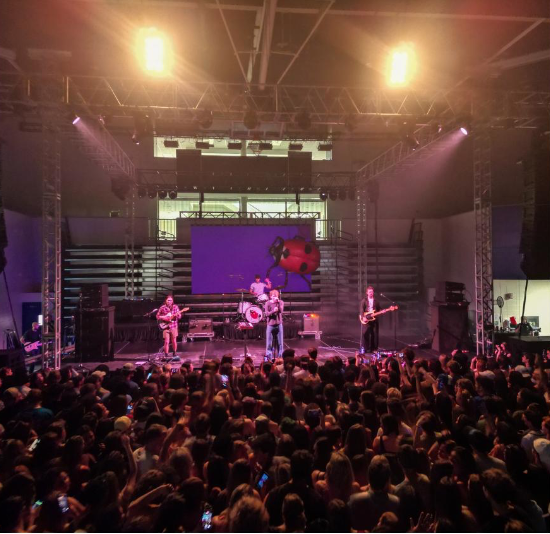 COIN performs for GC students in the Centennial Center